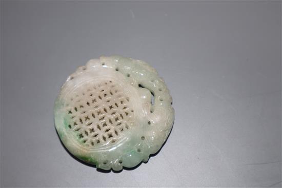 A carved jade plaque, diameter 5cm